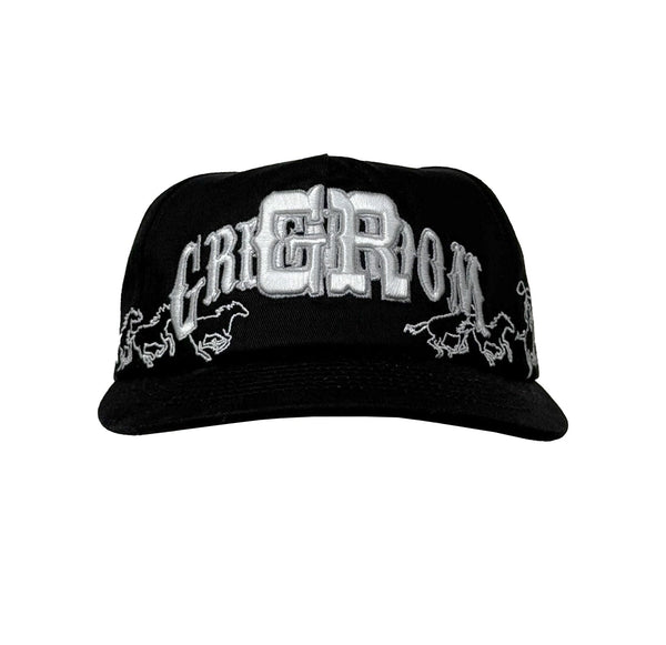 Black cap with white embroidered text and logos on a white background
